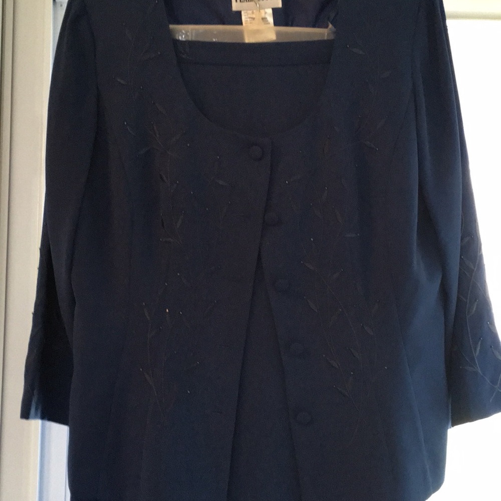 Two piece navy blue suit.